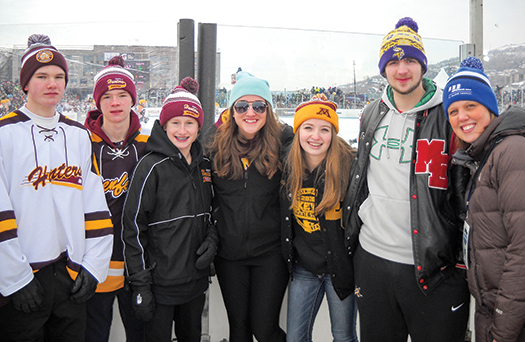Aimee Curtis Administrator, Community Relations and Minnesota Power Foundation, with students at Minnesota Hockey Day